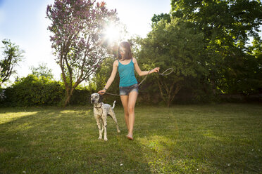 Girl with Dalmatian in the garden - LVF06963