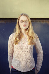 Portrait of young woman outdoors, long blonde hair and glasses - CUF04046