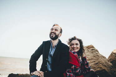 Mid adult couple laughing together on beach, Odessa Oblast, Ukraine - ISF00933