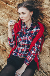 Portrait of mid adult woman leaning against beach cliff, Odessa Oblast, Ukraine - ISF00934