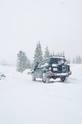 Off-road vehicle on snow-covered field, Gurne, Ukraine - ISF00935