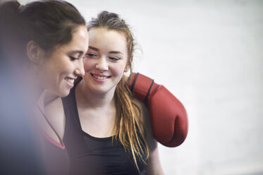 Two young female boxing friends in gym - CUF04288