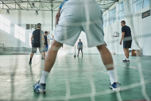Men playing indoor soccer - ZEDF01414