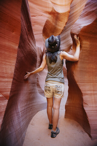 USA, Arizona, Woman with cowboy hat visiting Antelope Canyon stock photo