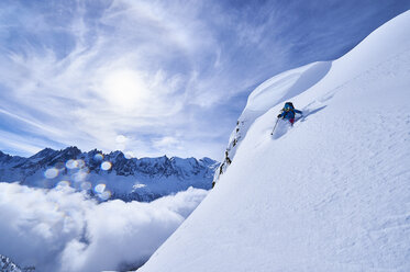 Woman skiing down steep mountainside in Swiss Alps, Gstaad, Switzerland - CUF04782