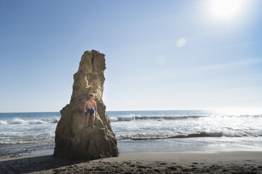 Boy on rock, El Matador Beach, Malibu, USA - ISF01231