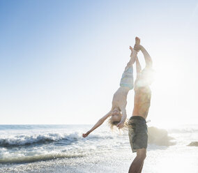 Brothers playing on El Matador Beach, Malibu, USA - ISF01238