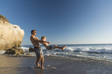 Brothers playing on El Matador Beach, Malibu, USA - ISF01242