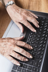 Senior woman using laptop, close-up - ISF01285