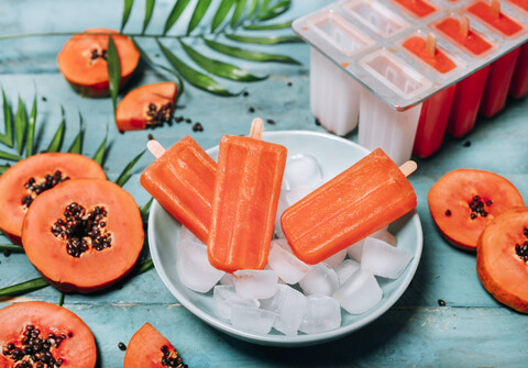 Homemade papaya ice lollies stock photo