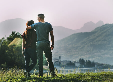 Couple standing in rural setting, looking at view, rear view - CUF05012