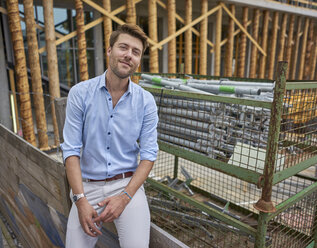 Businessman at construction site - BEF00056