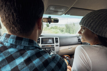 Couple in car, on road trip, rear view, Silverthorne, Colorado, USA - ISF01344