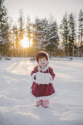 Portrait of young girl standing in snow - ISF01394