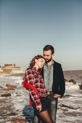 Romantic mid adult couple standing on beach, Odessa Oblast, Ukraine - ISF01425
