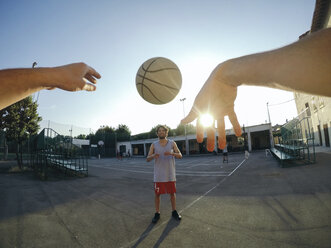 Point of view image of man throwing basketball at teammate - CUF05876
