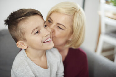 Grandmother kissing grandson's cheek - CUF06003