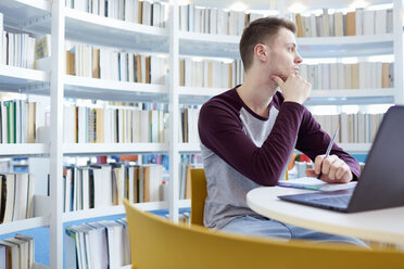 University student day-dreaming in library - CUF06052