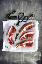Lamb chops on greaseproof paper, overhead view - CUF06188