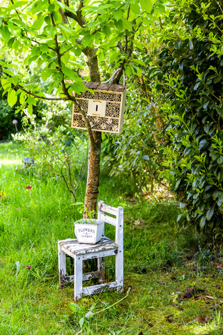 Insect hotel in a garden stock photo