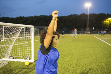 Female football player jubilant, Hackney, East London, UK - CUF07225