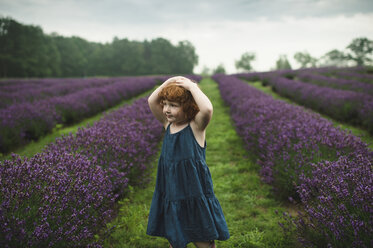 Toddler between rows of lavender, Campbellcroft, Canada - CUF07698