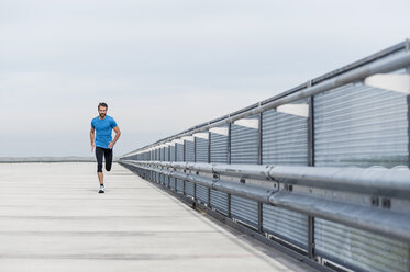 Man running on a parking level - DIGF04256