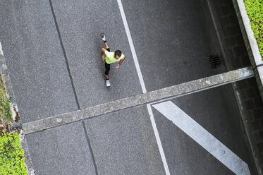 Top view of man running on a street - DIGF04260