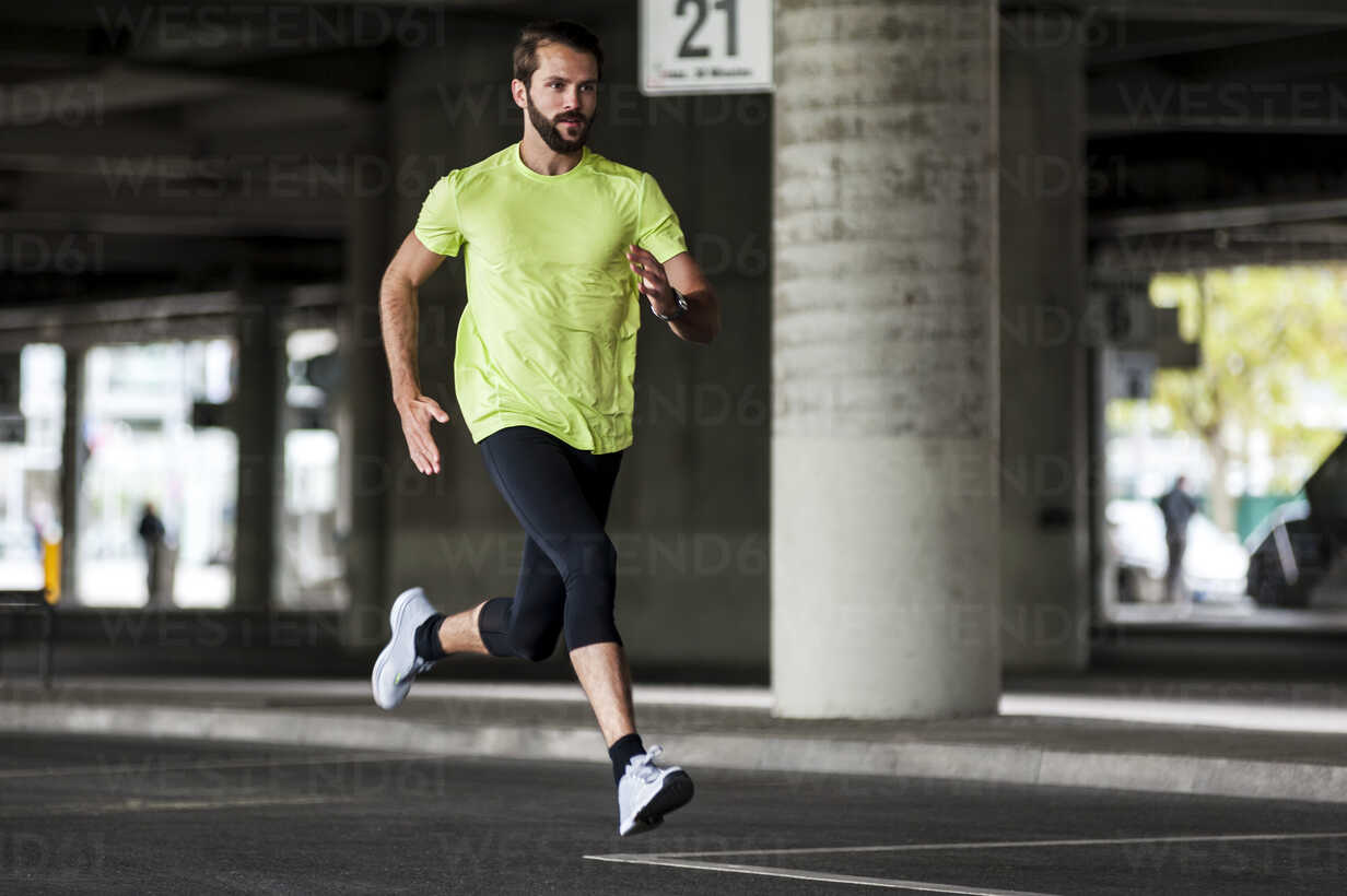 Man running on a street stock photo