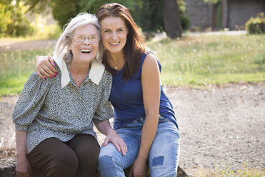 Portrait of mid adult woman, hugging granddmother - CUF07898