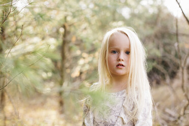 Blond-haired girl in forest - ISF01810