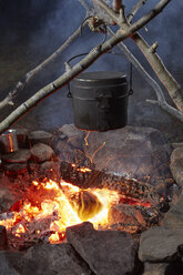 Pot of food cooking over camp fire, close-up, Colgate Lake Wild Forest, Catskill Park, New York State, USA - ISF02036