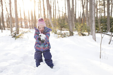 Girl playing with snow, Peterborough, Ontario - ISF02051
