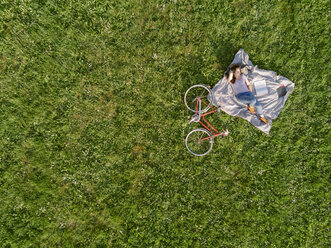 Woman relaxing on grass - ISF02077