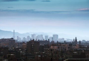 Elevated cityscape and hazy skyline at dusk, Barcelona, Spain - CUF08072