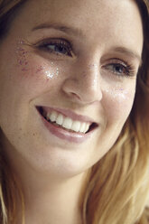 Portrait of woman with glittery face - CUF08300