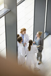 Group of doctors having discussion, elevated view - CUF08681