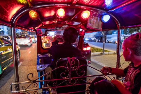 Thailand, Bangkok, boy riding Tuk-Tuk Taxi - MMIF00073