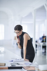 Businesswoman working in office - CUF09057