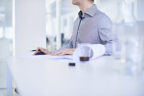 Cropped view of man working in office stock photo