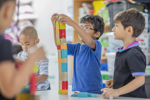 Boys stacking building blocks in kindergarten - ZEF15434