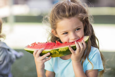 Girl eating a watermelon in kindergarten - ZEF15475