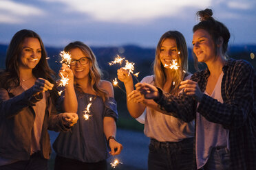 Friends playing with sparklers - CUF09691