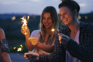 Friends playing with sparklers - CUF09692