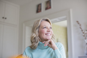 Smiling, ambitious mature woman looking away - HOXF03561