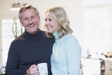 Portrait smiling mature couple drinking tea - HOXF03584