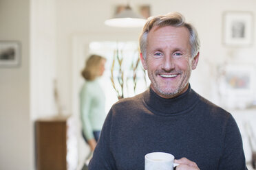 Portrait smiling, confident mature man drinking tea - HOXF03611