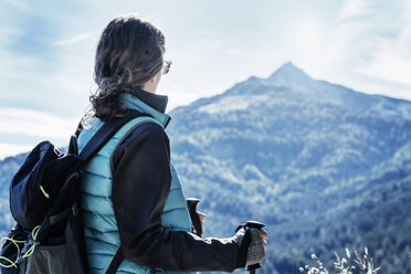 Hiker looking away at view of mountain, Madonna di Pietralba, Trentino-Alto Adige, Italy, Europe - CUF10136