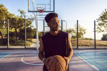 Young man in basketball court - CUF10412