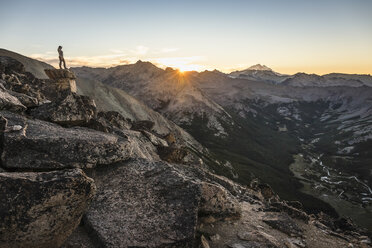 Female mountaineer looking out over Andes mountain range, Nahuel Huapi National Park, Rio Negro, Argentina - CUF10461